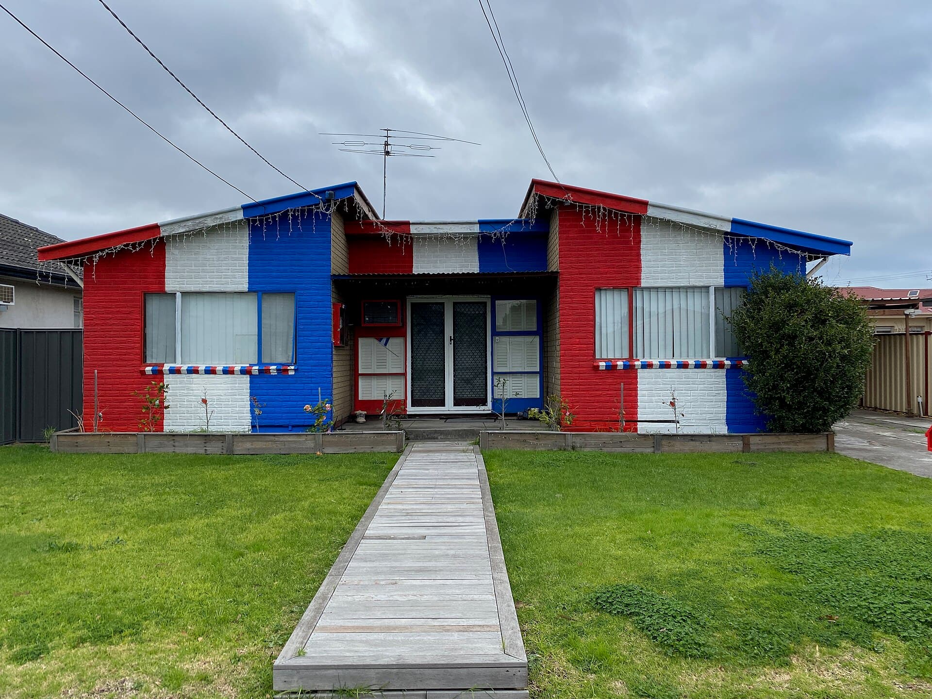 Contextual image of House painted in Western Bulldogs team colours, Melbourne